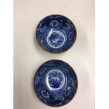 Pair of Chinese tea dust glazed blue and white painted bowls