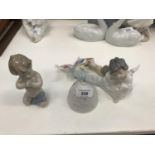 Lladro seated angel, praying boy, bell and butterfly