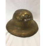 WWII Unusual Brass rounded tin helmet.