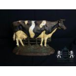 Cast iron vintage painted cow doorstop.