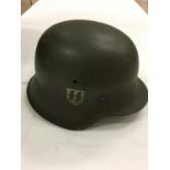 WWII German M35 tin hat, bearing SS decals, Eight fingered liner, non folded rim, impressed