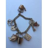 9ct charm bracelet 7 charms approx 20.8g