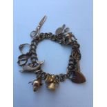 9ct charm bracelet 8 charms approx 26g