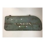 Vintage metal machineryt cover marked "London".