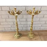 Pair of gilt bronze Fratin c1820 candleabra, the base with hunting weapons and swords, the sticks