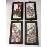Four framed chinese wall panels.