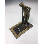 Austrian style bronze of woman on carpet.