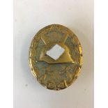 WWII Style German gold wound badge.