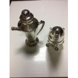 Two novelty silver plated cocktail shakers.
