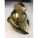 Modern brass merryweather firemans helmet.