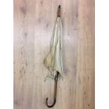 Edwardian carved wood handled umbrella with hoof finial.