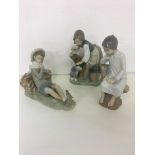 Three Lladro figures to include girl with dog and vase, and boy with birds