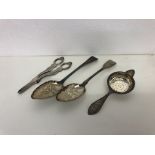 Hallmarked silver items to include Georgian serving spoons, grape scissors and strainer