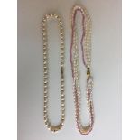 Two gold clasped pearl necklace