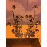 Two pairs of candelabra, brass and chrome.