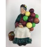 Early Royal Doulton "The old balloon seller", hand written to the base HN1315.