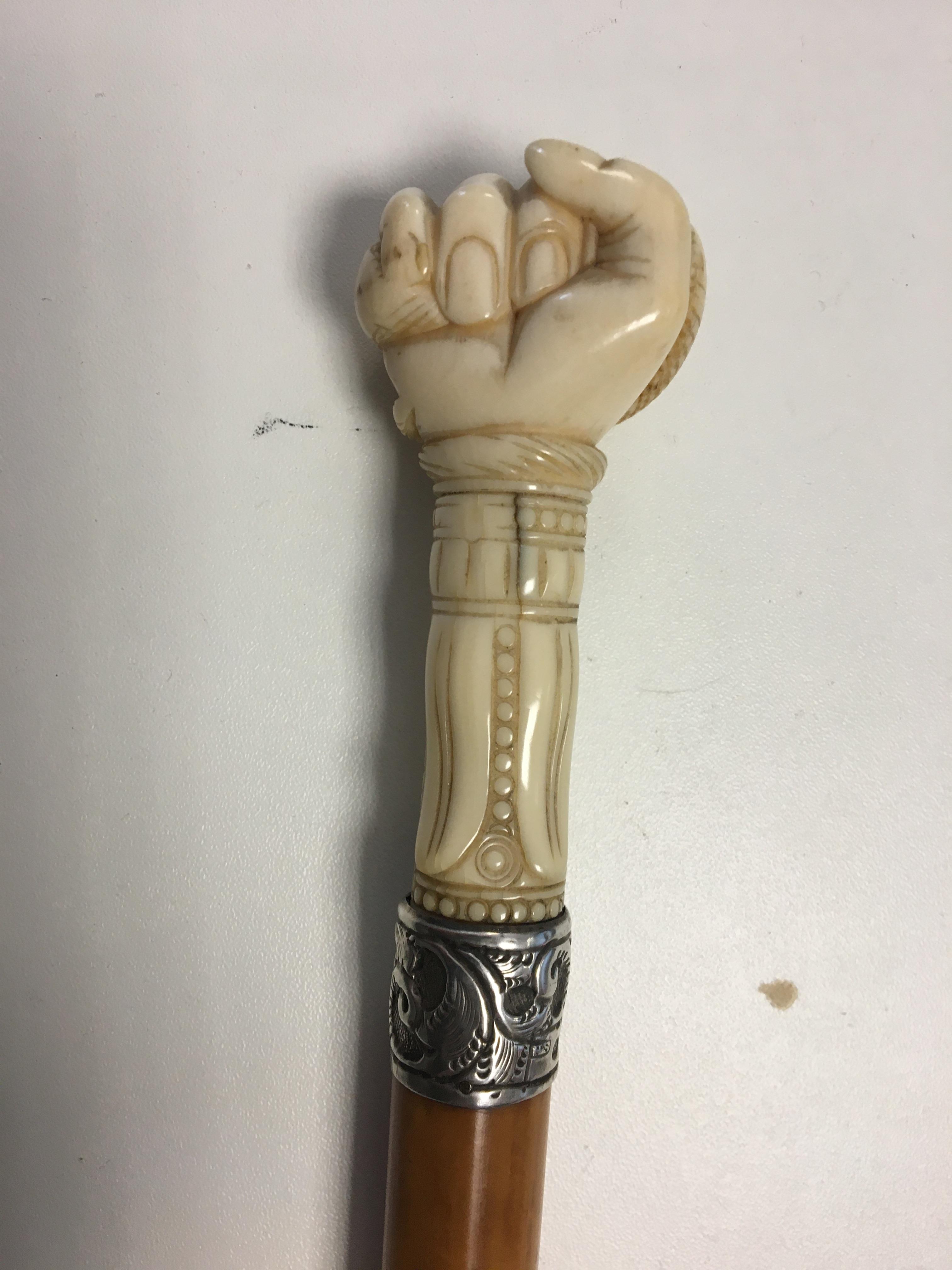 Victorian Silver collared Ivory handled walking cane carved as a hand with a snake.hallmarked