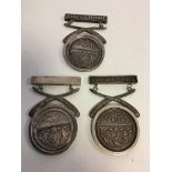 Three Province Curling medals.to the R.C.C.C., two uninscribed medals within broom mounts