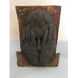 Mark Pope Ceramic Art wall hanging of a man with hands over his face.