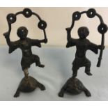 Pair of early 20th C Chinese Bronze 3 toed frogs with boys juggling coins on there backs.