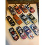 NASCAR die-cast money box cars and sweet tins.