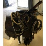 American Tex-Tan 17" seat saddle, Rawhide stirrups and pommel, saddle bags and rope and gun slip.