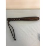 19th C short Lignum Vitae truncheon impressed with numbers and a capital H,measures 12.5 inches long