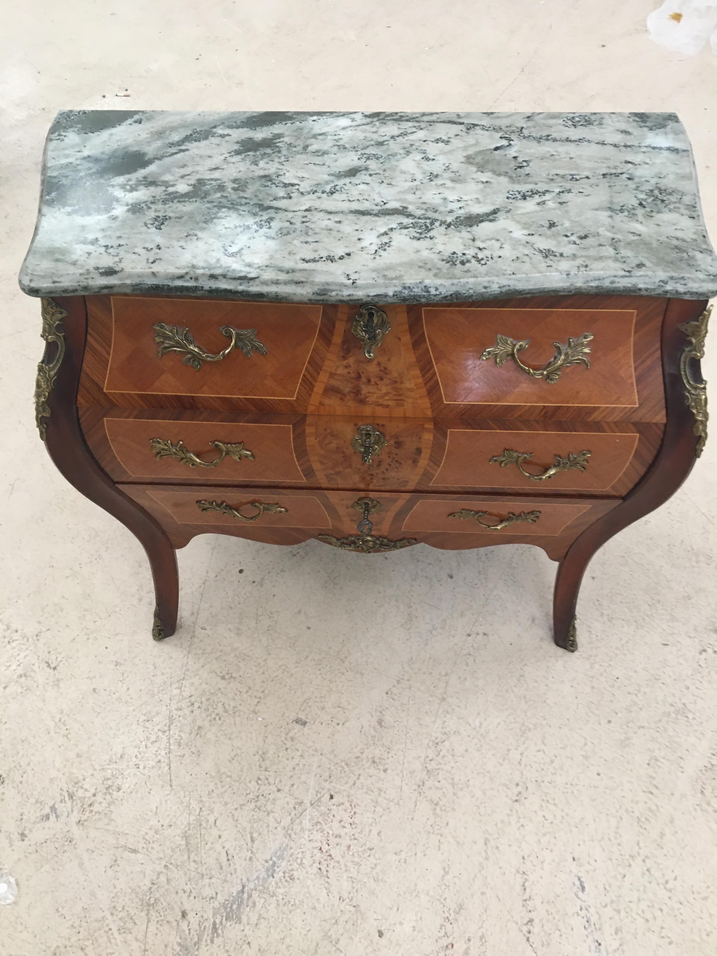 Louis XVI style marble topped Bombe commode.