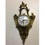 Bronze 19th c wall hanging clock, dial approx 3 inches.