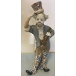 Lladro Clown holding a violin.