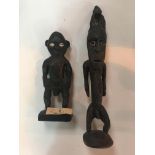 Two 19th c African carved ancestral figures with Cowrie shell eyes.