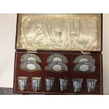 Cased HM Silver Royal Worcester coffee cup and saucer set.,in monochrome Fleur-De-Lis pattern, the