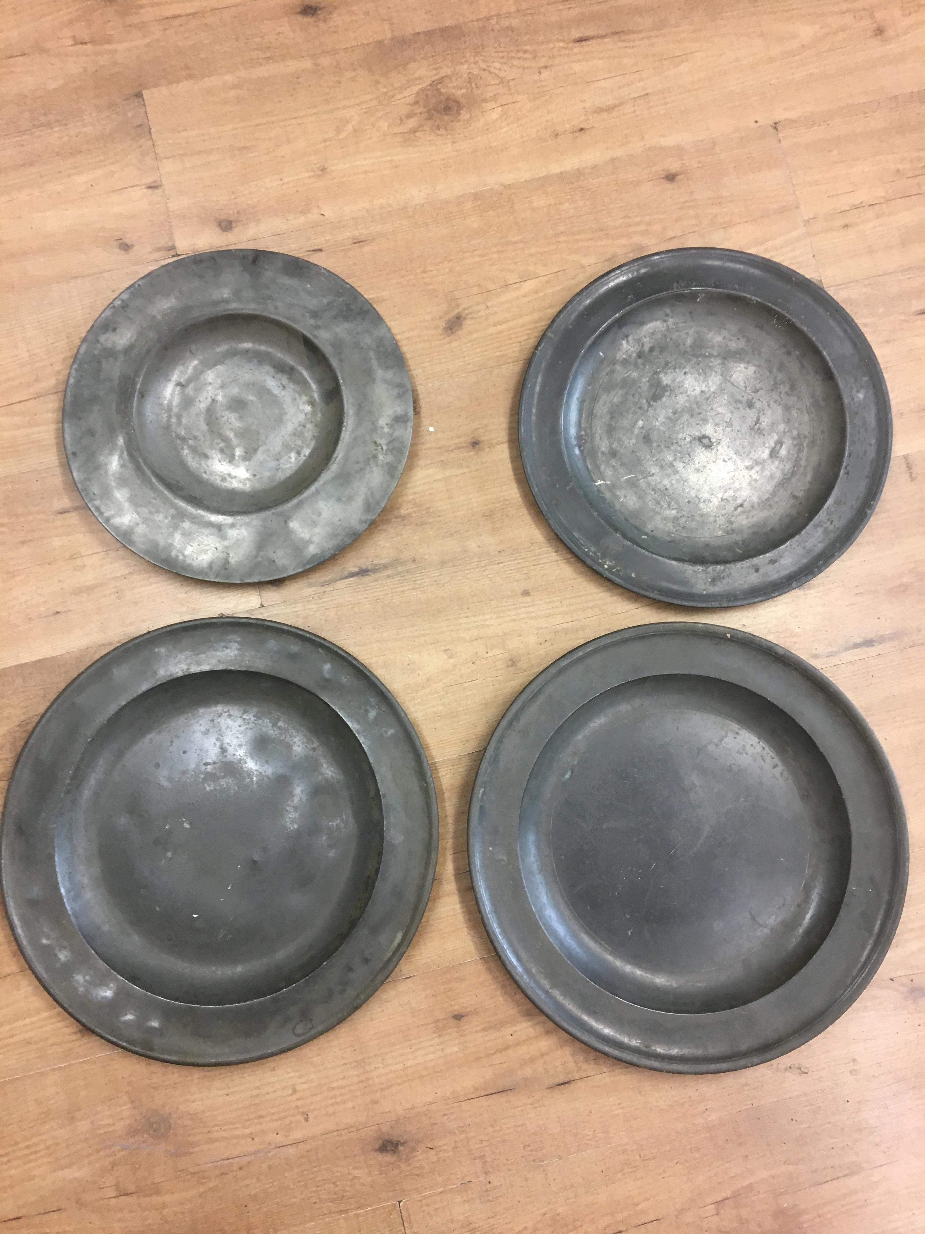 Four 18/19th century pewter platters marked evans etc