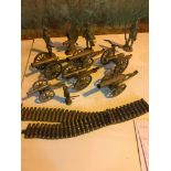Brass cannons, bullets and soldier figures.