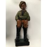 Large painted plaster figure of boy in boots with a pipe entitled like papa.