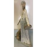 Lladro large figure of a gypsy girl with tambourine and shell necklaces with a bear.