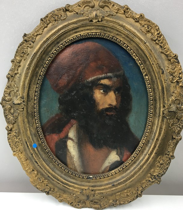 19th c Hungarian oil of Bearded man in red hat, in gilt oval frame.