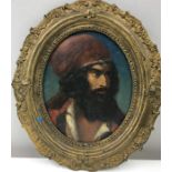 19th c Hungarian oil of Bearded man in red hat, in gilt oval frame.