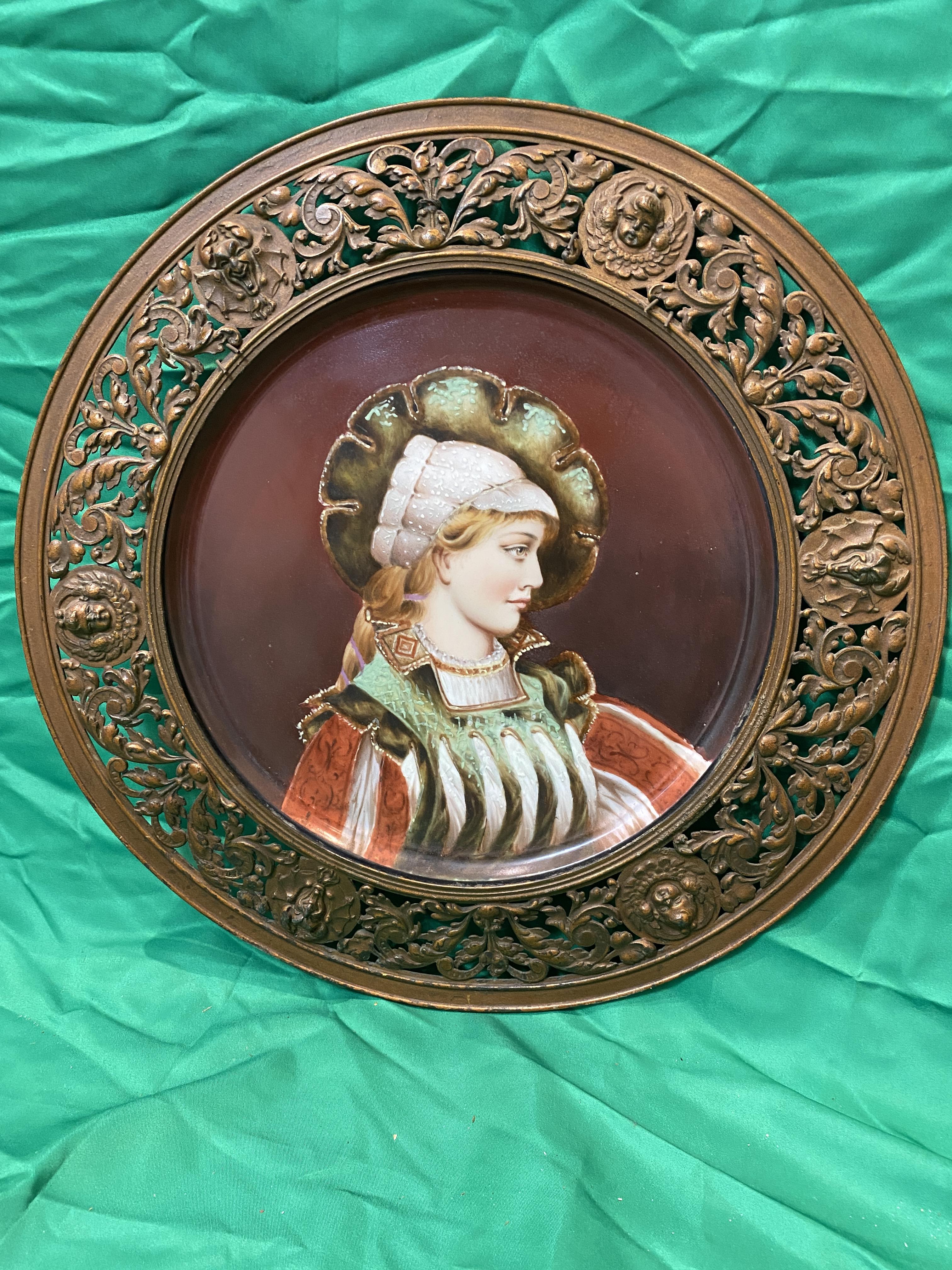 19th C Continental painted ceramic plaque portrait of woman in ornate filigree metal surround.