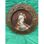 19th C Continental painted ceramic plaque portrait of woman in ornate filigree metal surround.