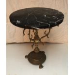 Marble topped circular side table on ornate brass column base.