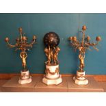 19th C Clock garniture, with bronze ball dial being held by three gilded putti on a garlanded marble