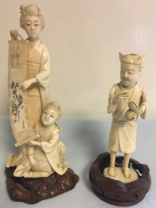Meiji period finely carved Okimono of woman and child with scroll and a bone example.height 17.5cm