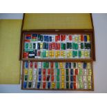 VINTAGE TOYS: A large fitted wooden case containing 128 TRI-ANG MINIX cars and a coach - as lotted -