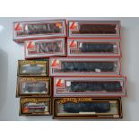 OO GAUGE MODEL RAILWAYS: A quantity of wagons and parcel vans by LIMA and MAINLINE - G/VG in G boxes