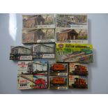 OO GAUGE MODEL RAILWAYS: A group of AIRFIX unbuilt plastic kits comprising wagons, buildings and