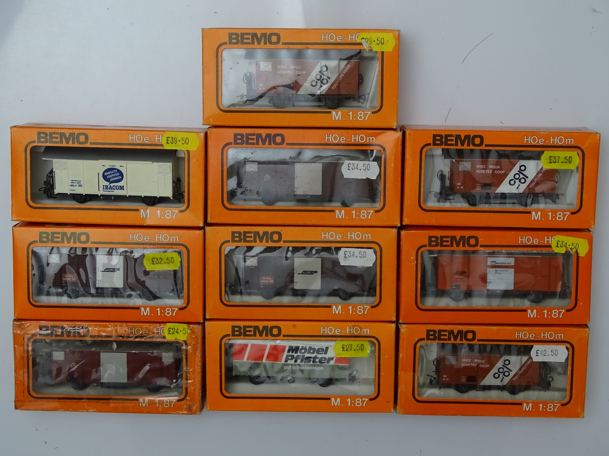 HOm GAUGE MODEL RAILWAYS: A group of BEMO HOm mixed wagons in various liveries - G/VG in F/G