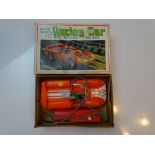 VINTAGE TOYS: A MARX battery operated racing car in original box - G in F/G box
