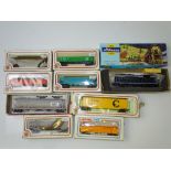 HO GAUGE MODEL RAILWAYS: A quantity of American Outline rolling stock to include: a diesel loco by