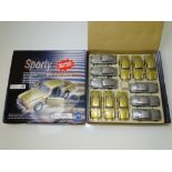 GENERAL DIECAST: Two trade boxes of toy diecast Aston Martins in gold and silver - with pull back